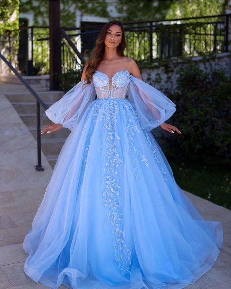 The cascading blue gown with intricate embroidery work and a gorgeous off-shoulder bodice design. If you want to make a lasting impression for your wedding festivities, this is the right pick of gown for you. #gown #gowndesign Blue Lace Prom Dress, Blue Sparkly Dress, Wedding Party Robes, Puffy Long Sleeves, Prom Dresses 2023, Lace Prom Dresses, Corset Dress Prom, Floral Gown, Cute Prom Dresses