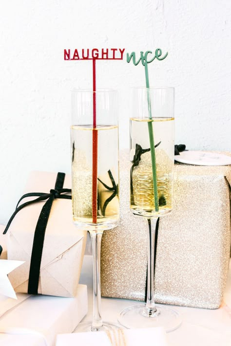 Naughty or Nice? Claim your cup with a cute little Christmas drink stirrer! Perfect for Christmas parties, intimate events, and the holidays, these unique drink tags make the most adorable embellishment to your cocktails. Simply pop them into a champagne flute or wine glass and use them as place cards or party favors for your guests!Set of 12 // 2 stirrers per designMeasurements: Approximately 2-2.5" W x 6.5" H Material: AcrylicSafe to use in hot and cold beveragesCare instructions:Kindly hand w Simple Christmas Party Decor, Friends Christmas Party Ideas Decor, Christmas Cocktail Party Ideas, Christmas Drink Stirrers, Christmas Bachelorette Party, Christmas Engagement Party, Intimate Events, Classy Christmas Party, Holiday Party Drinks