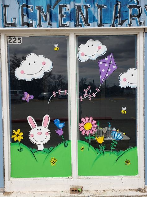 Spring window painting Easter Window Drawing Ideas, Window Decor Ideas For Preschool, School Windows Decorations, Window Preschool Decoration, Window Decoration For Classroom, Kindergarten Window Design, April Window Painting, Easter Window Display Paint, Spring Preschool Decorations