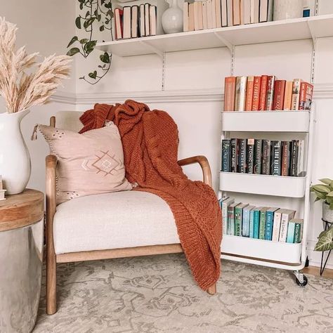 Reading Nook with Books on rolling metal cart via @lauren.m.mills Book Corner Apartment, Cozy Reading Corners Living Room, Reading Corner Bookshelf, Book Corner Ideas Bedroom Cozy Nook, Book Reading Corner Ideas, Cozy Reading Nook In Bedroom, Cozy Bedroom Reading Corner, Reading Corner Bedroom Adult, Sacramento Apartment