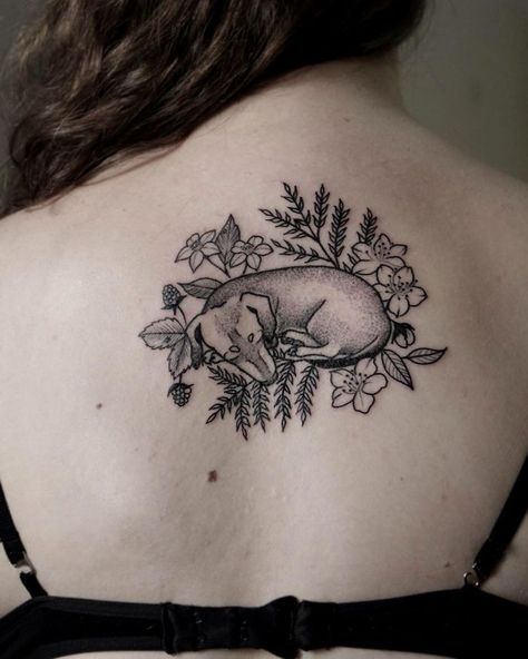 10+ Of The Best Dog Tattoo Ideas Ever Sweet Dog Tattoo, Whimsical Dog Tattoo, Dog With Halo Tattoo, Brindle Dog Tattoo, Curled Up Dog Tattoo, Dog Laying Down Tattoo, Dachshund Memorial Tattoo, Dog Tattoo Flowers, Dog Curled Up Tattoo