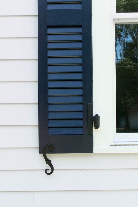 This coastal cottage features SW In The Navy dark blue shutters with black hardware. Discover how to create this look in our blog. #coastalcottagemakeover #thecolorconcierge #swinthenavy #exterior paint colors #jameshardiearcticwhite #colorsmadeeasy Coastal Shutters, Coastal Cottage Exterior, Navy Shutters, Cottage Shutters, Shutter Colors, House Shutters, Blue Shutters, Farmhouse Paint Colors, Farmhouse Paint