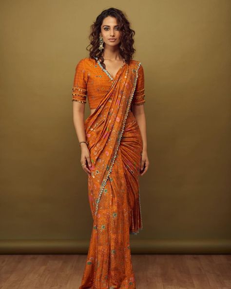 meenakshi chudahry in orange saree by sonam luthria for hit 2 Rust Skirt, Meenakshi Chaudhary, Pre Draped Saree, Skirt Saree, Choli Blouse Design, Draped Saree, Choli Blouse, Tiered Blouse, Orange Saree