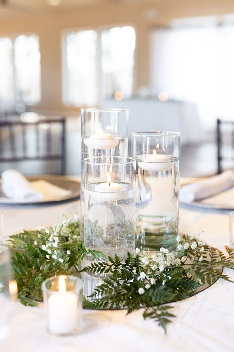 Floating Candles And Eucalyptus, White Wedding Centerpieces Simple, Mirror Centerpiece Wedding, Mirror Candle Centerpiece, Mirror Centerpiece Ideas, Simple Candle Centerpieces, Candle Votive Centerpiece, Cylinder Centerpieces, Outdoor Wedding Centerpieces