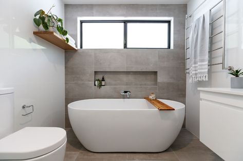 Small bathroom with a freestanding tub Bath Shelf Wall, Grey Feature Wall Bathroom, Free Standing Bath With Shelf, Recess In Bathroom Wall, Bath With Recessed Shelf, Bath Feature Wall Tile, Bath Recess Shelf, En Suite With Free Standing Bath, 300x600 Tiles Bathroom