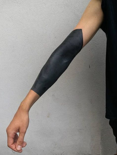 These Striking Solid Black Tattoos Will Make You Want To Go All In - KickAss Things Wrist Blackout Tattoo, Raw Tattoo, Blackout Sleeve, Black Band Tattoo, Black Sleeve Tattoo, All Black Tattoos, Solid Black Tattoo, Black Art Tattoo, Black Tattoo Cover Up