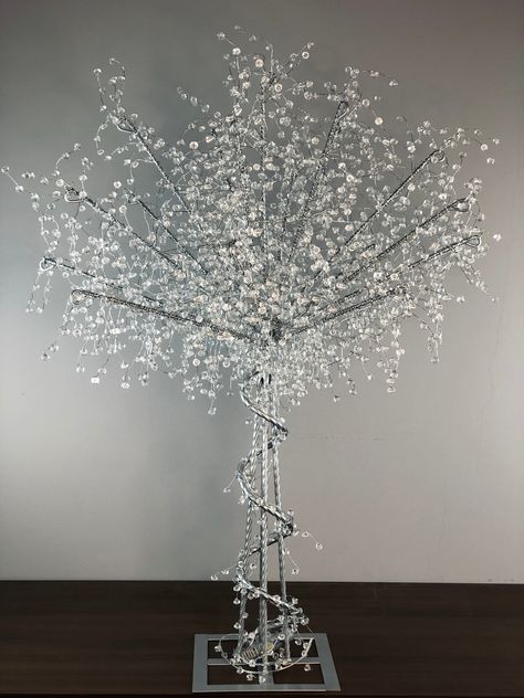 What makes this glitter tree special? All handmade high-purity acrylic beads, powered by an external battery box, you can place them on the table at will, adding romantic colors to your wedding and birthday parties. Especially at night, it shines brightly, putting you in a shining fantasy realm。 Overall Height: 36″ Base Diameter: 6.3inch Material :metal, acrylic Color：Silver Weight: Around 5LBs Power Mode: Battery Controlled Battery Included : NO Control Battery：3 AA Batteries White Tree Centerpieces, Sparkly Wedding Decorations, Winter Wonderland Baby Shower Ideas Centerpieces, Sparkly Wedding Decor, Wedding Ice Sculpture, Winter Wonderland Wedding Centerpieces, Winter Reception, Crystal Wedding Decor, Sweet 16 Winter Wonderland