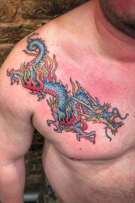 Boy Rigth Chest color dragon tattoo #dragontattoo #chesttattoo #mentattoo #tattoo #dragon #colortattoo Color Dragon Tattoo, Dragon Tattoo Full Sleeve, Traditional Tattoo Dragon, Dragon Tiger Tattoo, Geometric Heart Tattoo, Dragon Tattoo Shoulder, Dragon Tattoo Chest, Dragon Tattoo Meaning, Red Dragon Tattoo