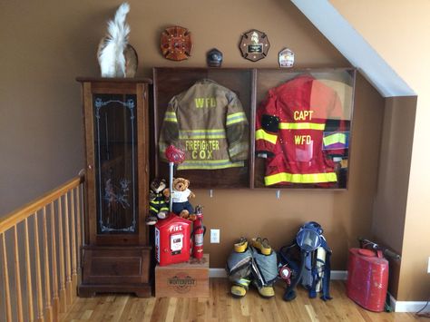 Fire gear shadow box Firefighter Gear Display, Fire Chief Office Ideas, Firefighter Room Man Caves, Firefighter Shadow Box Ideas, Fire Hose Projects, Firefighter Man Cave, Fireman Decor, Acorn Decor, Firefighter Room