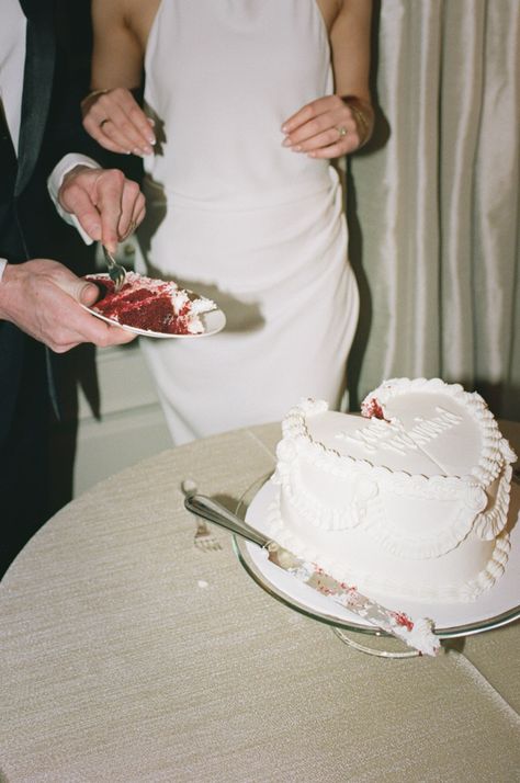 Couple share a piece of their red velvet wedding cake. Vintage, all white wedding cake with piping. 70s style.   At Graydon Hall Manor. Wedding Cake With Piping, Cake With Piping, All White Wedding Cake, Red Velvet Wedding, Heart Shaped Wedding Cakes, Graydon Hall Manor, Red Velvet Wedding Cake, Heart Wedding Cakes, Vintage Wedding Cake