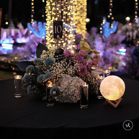 Galaxy Flower Arrangement, Night Sky Wedding Centerpieces, Celestial Floral Arrangements, Coldplay Wedding Theme, Galaxy Wedding Centerpieces, Celestial Table Setting, Celestial Centerpiece Wedding, Celestial Wedding Flowers, Celestial Centerpieces