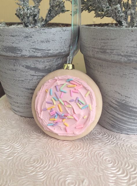 This is an adorable Iced Sugar Cookie Christmas ornament .  This adorable cookie is iced with pink frosting topped with pastel sprinkles and would make a beautiful addition to your candy themed holiday!  Perfect way to bring in the season!! This cookie is approximately 3 inches in diameter  **This is a hand made item , so each one is not exactly the same, there may be differences ** Sugar Cookie Christmas, Pastel Christmas Decor, Candy Decorations Diy, Cookie Christmas, Candy Ornaments, Ornament Cookies, Candy Decorations, Homemade Holiday, Candy Christmas Decorations