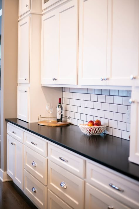 Subway tile kitchen with white cabinets and black granite countertops! Traditional home design with distressed wood decals and wall decor! White Subway Tile Black Countertops, Kitchen Design With Black Granite Top, Wood Decals, White Cabinets Black Countertops, Kitchen With White Cabinets, Black Kitchen Countertops, Kitchen Cabinet Trends, Outdoor Kitchen Countertops, Black Granite Countertops