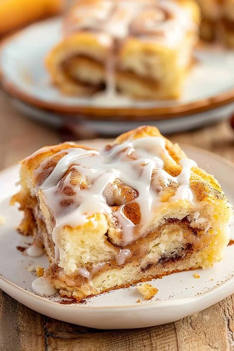 This cinnamon roll cake has a tender, moist crumb, swirls of cinnamon sugar throughout, and a sweet vanilla glaze on top. It's absolutely to die for! Cinabun Cake Recipes, Cinnamon Roll Ooey Gooey Cake, Morning Cake Recipes, Cinnamon Sugar Glaze, Cinammon Roll Cake, Cake Rolls Recipes, Cinnabon Cinnamon Roll Cake, Cinnamon Roll Cake Recipe, Cinnamon Toast Recipe