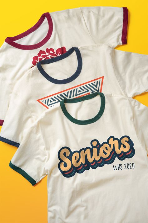 Put a new spin on an old classic. Check out our favorite design ideas and templates for helping you make your custom t-shirts shine. University Shirt Design Ideas, Class Tshirts, Senior Class Shirts, Minimal Shirt Design, Class Shirts, Class Shirt, Shirt Logo Design, Senior Shirts, Retro Styles