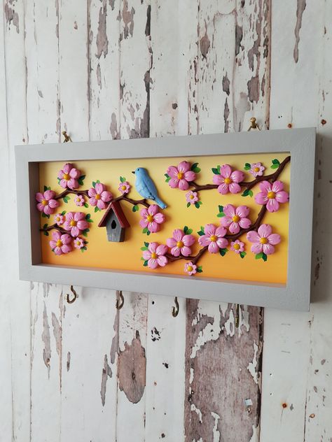 Excited to share the latest addition to my #etsy shop: Nature Scenery Key Hanger For Wall / 3D Blue Bird and Pink Flower Tree Key Chain Hanger / Wooden Deep Frame Unique Design Home Gift Idea #coastaltropical #entryway #walldecorkeyhook #keyholderdecor #flowerloversgift #housewarminggift #keyholderforwall #flowergardenart https://etsy.me/3R3Gf92 Wood Frame Decor Ideas, Wooden Hanging Decor, Wall Hanging Showpiece, Lippan Art Bird Design, Diy Wooden Key Holder Ideas, Clay Name Plates For Home, Key Holder Ideas Creative, Clay Key Holder, Pichwai Wall Hanging