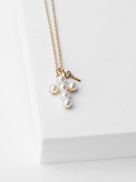 16" Dainty chain with 2" extender Lobster clasp closure Chain features a Pearl Cross and a mini key charm engraved with GRACE or HOPE Not available for customization Bday Stuff, Pearl Cross Necklace, Giving Keys, Cross Charm Necklace, Exchange Student, Key Jewelry, Dainty Chain, Pearl Collection, Key Necklace