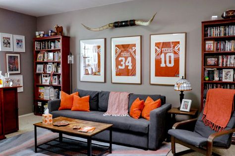 Sports Room Decor Man Caves, Sports Themed Family Room, Tasteful Sports Decor Man Cave, Man Cave Spare Bedroom, Classy Sports Decor, Man Cave Gallery Wall, Man Cave Living Room Ideas, Men’s Decor Ideas, Basement Sports Decor