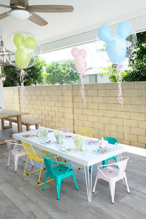 Charlotte's Pastel Disneyland | CatchMyParty.com Vintage Disneyland Party Decorations, Disneyland 3rd Birthday Party, Disneyland Party Games, Disneyland Pastel Birthday, Disneyland Party Food, Disney Centerpieces Birthday, Disneyland Party Ideas, Disney Theme Birthday Party For Girl, Disneyland Centerpieces