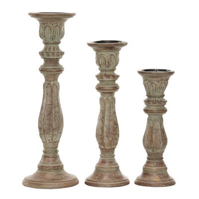 This mango wood candle holder set is a great decorative piece for the living room, the study room, and the dining area. Delight your guests and make any occasion extra special by adding a lighted or flameless candle to this candle holder centerpiece. Made with a sturdy base, it is perfect for creating an elegant atmosphere at your table top or mantel. Designed with black rubber stoppers at the base that prevent scratching furniture and table tops, as well as sliding around. These pillar candle h Distressed Candle Holders, Candle Plates, Three Candle Holder, Traditional Candle, Wood Candle Holder, Candleholder Centerpieces, Wooden Candle Sticks, Wood Candle, Wood Candle Sticks