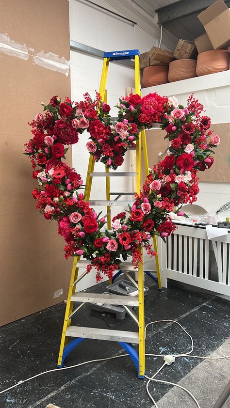 Transform your space into a romantic haven with our exquisite Valentine's Flower Display Wreath, designed to steal hearts and elevate your decor. Crafted with care in the UK, this stunning heart-shaped wreath is the perfect addition to large windows, restaurants, or shop displays, setting the mood for love and celebration. 🌹 Key Features: - Size 120 cms x 120 cms  - Made to Order in the UK: Each wreath is meticulously handcrafted just for you, ensuring that you receive a one-of-a-kind piece. - High-Quality Silk Flowers: Our wreath is adorned with lifelike tulips, roses, and cherry blossoms, made from premium silk materials that mimic the beauty of real blooms. - Long-Lasting Elegance: Designed to withstand the test of time, this wreath is a timeless investment that you can enjoy for years Valentine’s Day Store Window, Vitrine Saint Valentin, Florist Window Display, Valentines Window Display, Valentine Flowers, Flower Shop Design, Coordinates Decor, Mood For Love, Shop Displays