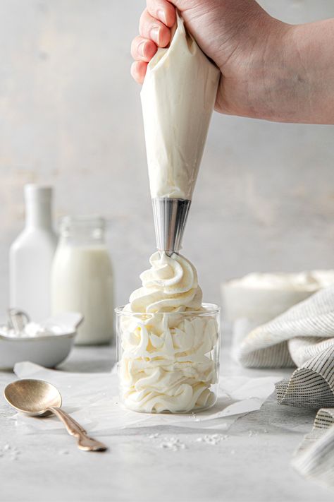 Homemade whipped cream being piped in swirls into a glass dessert cup. Mascarpone Frosting Recipe, Sturdy Whipped Cream Frosting, Stable Whipped Cream, Stabilized Whipped Cream Frosting, Cream Cheese Sugar Cookies, Whipped Cream Cheese Frosting, Mascarpone Frosting, Stabilized Whipped Cream, Cream Of Tarter