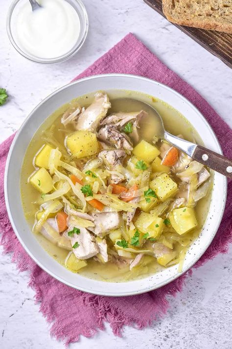 Want to make Russian Shchi? This classic cabbage soup is served hot & made with lots of simple ingredients like chicken, potatoes, and more! Russian Potato Soup, Chicken Soup With Cabbage Recipes, Russian Chicken Soup, Borsh Soup Recipes Russian, Russian Cabbage Soup Recipe, Shchi Soup Russia, Russian Cabbage Soup, Russian Fish Soup, Russian Chicken