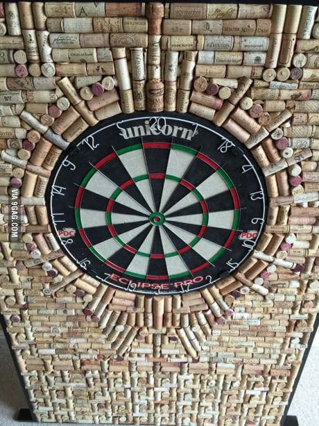 Over 1000 corks and a lot of time to finish my custom dartboard. Cork Dart Board, Dartboard Setup, Dart Backboard, Cricket Scoreboard, Cork Dartboard, Dart Board Wall, Diy Cork, Wine Cork Projects, Wine Cork Art