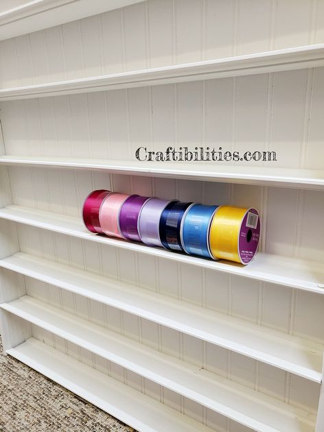 DIY ribbon storage shelf organizer - FINISHED! CRAFT ROOM wall holder/display/rack organization idea - How to make tutorial Ribbon Roll Storage Ideas, Ribbon Storage Wall Shelves, Ribbon Wall Storage, Diy Ribbon Organizer, Ribbon Storage Ideas Diy, Craft Room Wall Storage, Storing Wreaths, Diy Ribbon Holder, Ribbon Hacks