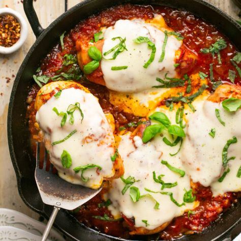 30-Minute Mozzarella Chicken Skillet Cheesy Mozzarella chicken is an insanely delicious high protein low-carb and keto friendly (just 4g net carbs!) weeknight dinner recipe! It’s pan seared chicken nestled in tomato sauce and topped with melty mozzarella, then baked to perfection. Ready in about 30 minutes! Prep Time 5 minutes mins Cook Time 25 minutes mins Total Time 30 minutes mins Course: Main CourseCuisine: American, ItalianKeyword: healthy, low-carb, mozzarella chicken Servings: 4 ... Chicken Parmesan Burgers, Healthy Chicken Parmesan, Pan Seared Chicken, Mozzarella Chicken, Yummy Chicken, Fried Chicken Breast, Delicious Burgers, Yummy Chicken Recipes, Weeknight Dinner Recipe