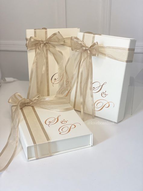 This classy ivory flat gift box is pretty AND versatile! Use as an envelope for your invitations or to gift jewellery and other small items! WHAT YOU GET: - 1 IVORY PEARL Gift box (A5) with a magnetic lid - ASSEMBLED - Personalisation on the inside and outside - Ribbon of your choice wrapped around the box - 22 COLOURS TO CHOOSE FROM - White shredded tissue paper Personalisation is free but limited to 2 words on the outside and 6 words on the inside 🤍 *Items in third picture are not included. 𝐒𝐢𝐳𝐞 Inside: 22cm x 16cm x 3.5cm Outside: 23.5cm x 17cm x 4cm Comfortably fits: cards, invites, necklace/jewellery sets, small A5 art pieces, photographs Ribbon length: Approx. 2m length Ribbed ribbon width: 2.5cm wide Satin ribbon width: 3.5cm wide Organza ribbon width: 3.5cm wid French Blue Sat Wedding Vinyl, Personalised Gift Box, Shredded Tissue Paper, Pearl Gifts, Bridesmaid Box, Personalised Gift Boxes, Maid Of Honour, Jewellery Sets, Rose Gold Pink