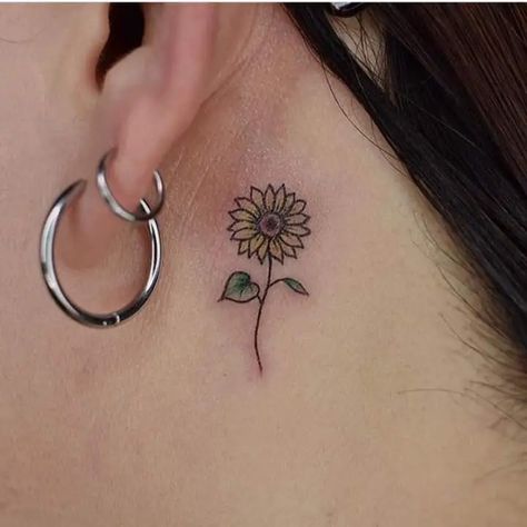 11 Pretty Sunflower Tattoo Ideas for Females 10 Cute Sunflower Tattoo, Tattoo Ideas For Females, Sunflower Tattoo Ideas, Behind Ear Tattoos, Birthday Tattoo, Finger Tattoo For Women, Finger Tats, Hand And Finger Tattoos, Flower Wrist Tattoos