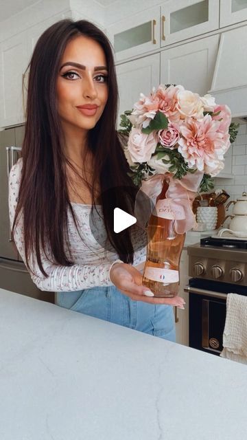 Muna Nijmeh on Instagram: "Wine Bouquet 💐   Here is a fun and gorgeous way to gift a bottle of wine! Grab a foam block from your craft store or @dollartree and pop it on top of the bottle! Then add florals to the foam to create a bouquet! You can add some cellophane wrap or a ribbon to finish it off!  This would be perfect for Mother’s Day or any event you are going to where you need a hostess gift!  🌺 SAVE THIS IDEA 🌺  #giftideas #mothersday #bouquets #giftidea #homeideas" Mothersday Bouquets, Wine Bottle Bouquet Diy, Wine Bottle Gift Wrapping, Bottle Arrangements, Wine Bouquet, Wine Bottles Gift Wrap, Wine Gift Wrapping, Bottle Gift Wrapping, Wine Bottle Gift