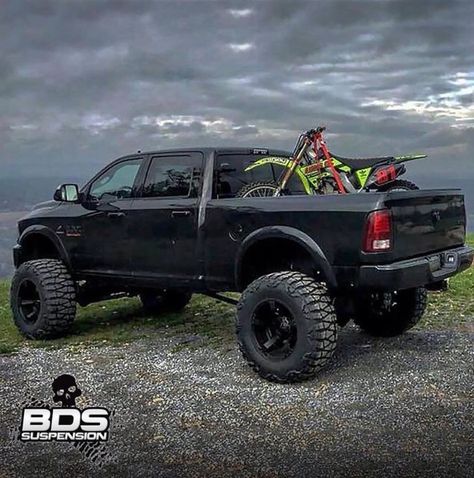 Big Black Dodge Cummins with Dirt Bike. Really like the tires on this set up! #Dodge #Cummins #Black #Lifted #Tires Lifted Cummins, Truck Lifted, Lifted Dodge, Dodge Diesel, Cummins Trucks, Trucks Lifted Diesel, Black Truck, Dream Trucks, Lowered Trucks