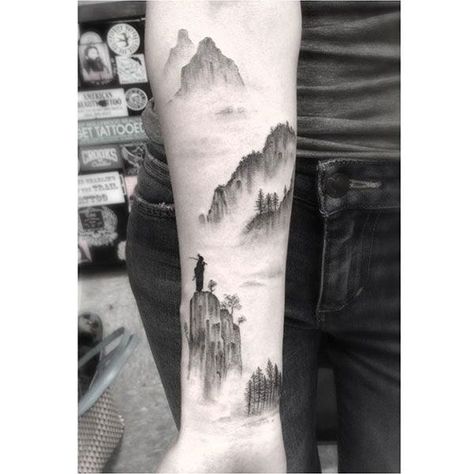 Imagine looking at your forearm and being reminded of your favorite skyline, or glancing at your wrist and being transported to Paris. Some people like to get a T-shirt with the name of a city they visited, or share photos from a particularly memorable trip; others prefer to have their memories Dr Woo Tattoo, Waterfall Tattoo, Berg Tattoo, Dr Woo, Geometric Wolf, Gorgeous Tattoos, Mountain Tattoo, Wolf Tattoos, Feather Tattoos