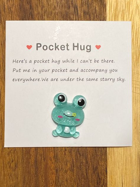 A Pocket Hug Frog novelty gift with black velvet gift bag Cute little frog to gift to a friend or loved one to keep in their pocket, purse or somewhere close by whenever they're in need of a little hug for a quick pick me up. Frog Gifts Ideas, Pocket Hug Ideas, Eid Sweets, Pocket Hugs, Frog Gifts, Pocket Hug, Cute Valentines, Bag Cute, Affirmation Cards