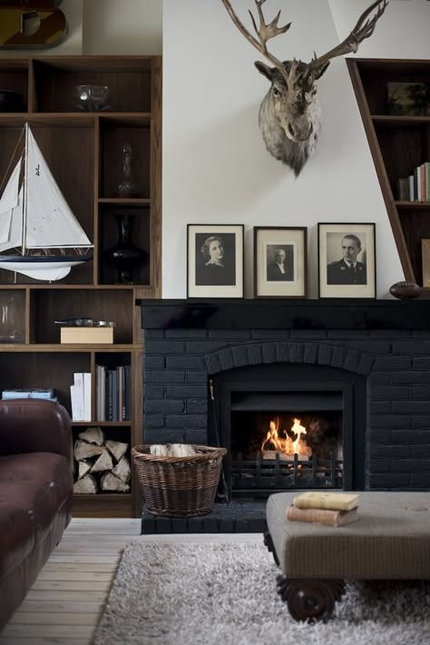 Antique photos, black brick, and white accessories add to this majestic monochromatic look! Mcgee Fireplace, Studio Mcgee Fireplace, Studio Mcgee Bedroom, Studio Mcgee Living Room, Fireplace Interior, Fireplace Design Ideas, Painted Fireplace, Country Fireplace, Masculine Decor