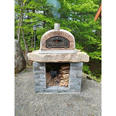 Buena Ventura Pizza Oven is absolutely stunning. The cast stone facade is in a warm authentic Portuguese Sienna sandy brick tone which intensifies the appearance of its stacked stone. This oven is the most traditional shape like the Pizzaioli, but with a different cast stacked stone facade. It has a wider opening and the lower dome conducts heat directly to the oven floor, which makes it ideal for cooking authentic Italian pizzas (in just 90 seconds!). It can even cook two 12″ pizza pies at once Cement Countertop, Woodfired Pizza Oven, Best Outdoor Pizza Oven, Outdoor Fireplace Pizza Oven, Brick Oven Outdoor, Authentic Pizza, Wood Burning Pizza Oven, Brick Pizza Oven, Stone Facade