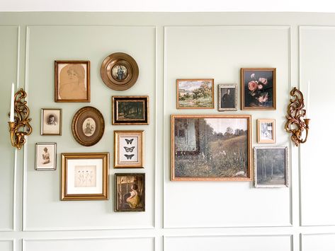 Mixing old family pictures with new prints found on Etsy was a great way to accent this wall in our guest room. Found frames fromna thrift store and used rub n buff to bring them back to life! Picture Frame Accent Wall Ideas, Gallery Wall Old Frames, Vintage Framed Wall Art, Gold Frames On Wall Living Rooms, Thrifted Photo Frame Wall, Mixed Gold Frame Gallery Wall, Gold Frame Gallery Wall Dining Room, Mixing Pictures And Art On Wall, Wall Collage Frames Ideas