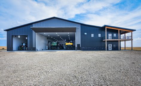 This ultimate farm shop includes a storage area for machinery, a wash bay, and even offices all in a 110' x 120' x 22' post frame building. Farm Shop Organization, Farm Shop Buildings, Farm Shop Ideas, Shop Layout Ideas, Tractor Storage, Farm Storage Buildings, Farm Equipment Storage, Ranch Truck, Pole Building Garage