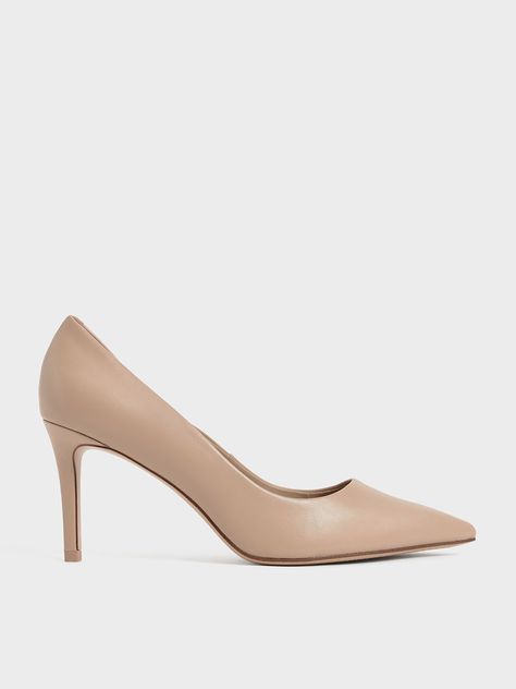 Nothing says classy quite like a pair of nude pumps. This version comes with pink undertones, plus a fierce pointed-toe design that will have you dressed to the nines for any occasion. Set on a sleek 8cm stiletto heel that is just irresistible, these pumps are all you need to put your best foot forward every day. For a glamorous look, we recommend styling them with a puff-sleeve dress and a structured bag. Sepatu Pump, Hak Tinggi, Work Heels, Ikat Pinggang, Toes Designs, Faux Leather Heels, Nude Pumps, Dressed To The Nines, Point Shoes