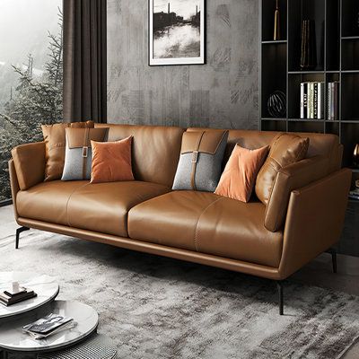 Introducing our all-new Sofa collection - an elegant blend of comfort and style. Available in a range of sizes to fit any space, this sofa is a testament to quality and craftsmanship. The seat, backrest, and armrests are wrapped in luxurious Top Grain Leather, offering a touch of elegance and warmth. As the leather ages, it reveals a rich, glossy patina, making it a timeless addition to your living room. The remaining areas are gracefully finished with Leather Match, providing a cohesive look wh Sleek Sofa Design Living Rooms, Deep Leather Couch, Vintage Leather Couch, Modern Leather Couch, Cozy Armchair, Leather Couches, Black Living Room Decor, Brown Leather Couch, Basement Office