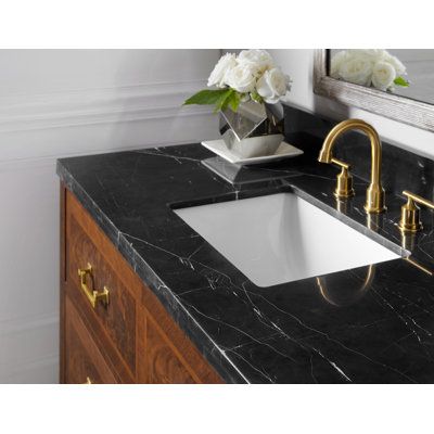 Features: Black-honed marble, solid brass hardware.Material: Crotch/straight walnut, cherry veneer.Top, backsplash, sink included, 8" spread, faucet not included.Countertop Material: MarbleTop Material Details: Black Honed MarbleTop Color: Black HonedTop Finish: Black HonedBase Color: BrownBase Material: Solid + Manufactured WoodBase Finish: BrownWood Species: Purposeful Distressing Type: No DistressingNumber of Sinks Accommodated: 1Sink Included: YesSink Type: IntegratedSink Material: Marble[OL Black Marble Vanity Bathroom, Black Countertops In Bathroom, Black Marble Countertops Bathroom, Dark Countertops Bathroom, Dark Bathroom Countertops, Black Countertops Bathroom, Black Granite Bathroom Countertops, Black Bathroom Counter, Black Bathroom Countertops