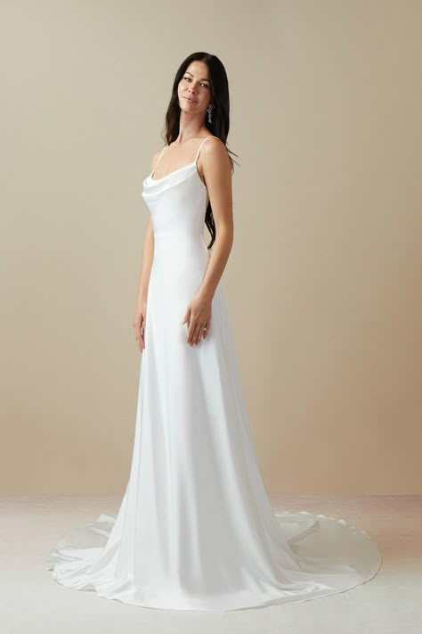 Shiv is our lovely bridal gown cut from crepe back satin. She features a cowl neckline paired with spaghetti straps and a V-back. The look is complete with a chapel length A-line skirt. Modern Elegant Wedding Dress, Moonlight Wedding Dress, Wedding Dress Beaded, Modern Elegant Wedding, Chapel Train Wedding Dress, Azazie Dresses, Neck Wedding Dress, Silk Wedding Dress, Wedding Dresses Beaded