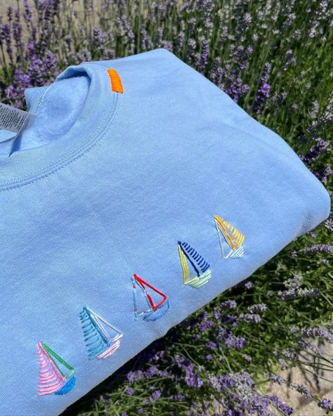 newest edition: sailboats! a fun custom piece for a special someone @haydenbrennen ⛵️🤭🩵🐚���🐟🐠 #stitchiesbyag #toronto #custom #handstitched #fyp #pinterest #uniquesweatshirts #customclothing #customdesign #design #clothing #sweatshirt #crewneck #summer #ocean #microinfluencer Patchwork Crewneck Ideas, Homemade Shirts Ideas Diy, Freehand Embroidery Ideas, Embording Design, Embording Ideas, Things To Embroider, Stitched Clothes, Sailboat Embroidery, Seashells Embroidery Designs