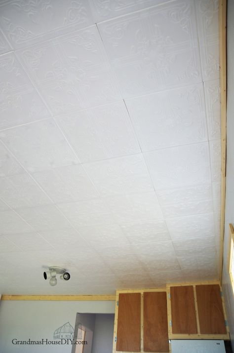 Easy to install Styrofoam do it yourself ceiling tiles over an ugly ceiling, how to Ceiling Tile Replacement Ideas, Covering Ceiling Tiles, How To Cover Ceiling Tiles, Styrofoam Ceiling Tiles Ideas, Painting Ceiling Tiles, Basement Ceiling Insulation, Basement Window Replacement, Basement Ceiling Ideas Cheap, Ceiling Alternatives