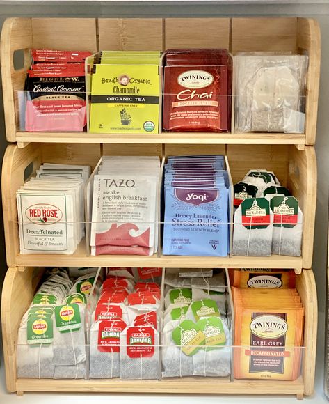 I had a difficult time finding the perfect organizer for my family's tea stash. Luckily, I found this gem on Amazon and it was perfect because it has three sections that were different sizes. Its perfect for if you buy one tea in larger quantities. It required minimal assembly and looks great on a countertop or in a cupboard. I have linked the Amazon page to this post for my tea lovers. As an Amazon Affiliate, I earn commission on eligible products. Tea Station Small Spaces, Tea Selection Display, Tea Spot In Kitchen, Tea Rack Ideas, Tea Pantry Organization, Herbal Tea Organization, How To Store Tea Bags, Cute Tea Station, Herbal Tea Storage