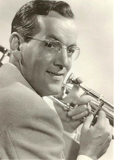 Glenn Miller (1904-1944) was an American jazz musician (trombone), arranger, composer, and bandleader in the swing era. He was one of the best-selling recording artists from 1939 to 1943, leading one of the best known "Big Bands". While he was traveling to entertain U.S. troops in France during World War II, Glenn Miller's plane disappeared in bad weather over the English Channel. Glen Miller, Popular Singers, Hollywood Glamor, Glenn Miller, Jazz Artists, Fav Music, Famous Personalities, Band Music, I'm With The Band