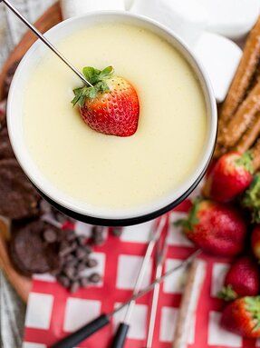 White Chocolate Fondue Recipe | Allrecipes White Chocolate Fondue, Chocolate Truffle Cookies, Dessert Fondue, Chocolate Fondue Recipe, Truffle Cookies, Fondue Recipe, Fondue Party, Fondue Recipes, Melting White Chocolate