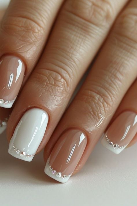 Are you in search of some attractive white nail designs to experiment with during this season? If yes, then you have landed on the right article! As summer is approaching, I have curated a list of my preferred styles to offer you some ideas. I have included various designs ranging from abstract to indie to cater to different preferences.Many of these styles can be easily replicated in the comfort of your own home! If you’re interested in trying a matte style Nails With White Dress, Simple Nail Art White, Wedding French Manicure, White On White French Manicure, Nail Manicure Ideas, Men Manicure, French Manicure Nail Art, Kids Manicure, White Nail Ideas